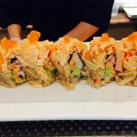 Kai Fan Roll · Salmon, yellowtail and avocado inside topped with spicy kani, ikura and sweet miso sauce.