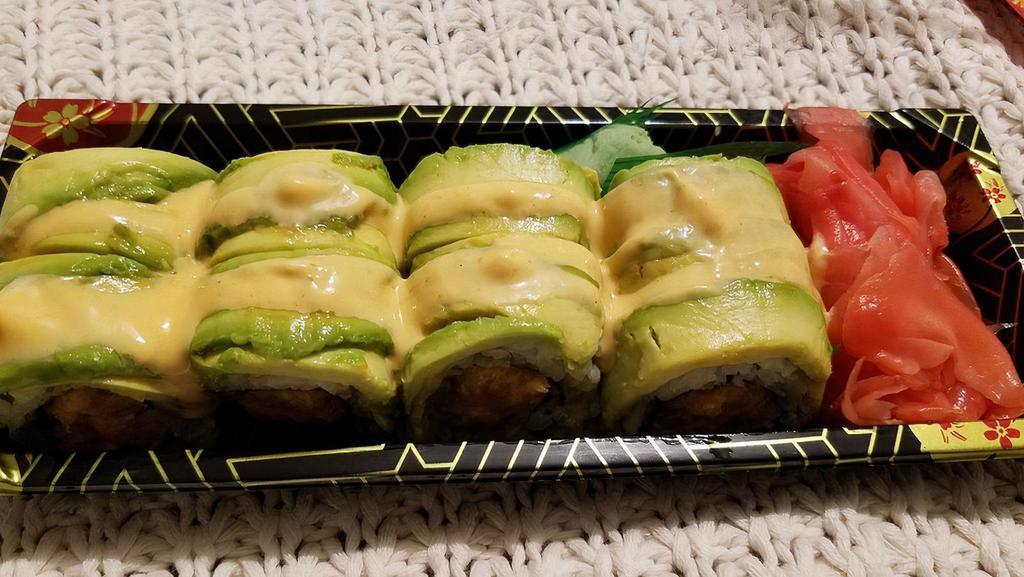 Rainbow Roll · Kani, cucumber, and avocados inside topped with salmon, tuna, yellowtail, and avocado.