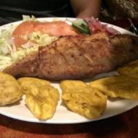 Pescado Frito - Pan Fried Whole Fish · Pan Fried Whole Fish with rice, beans, salad and fried plantains.