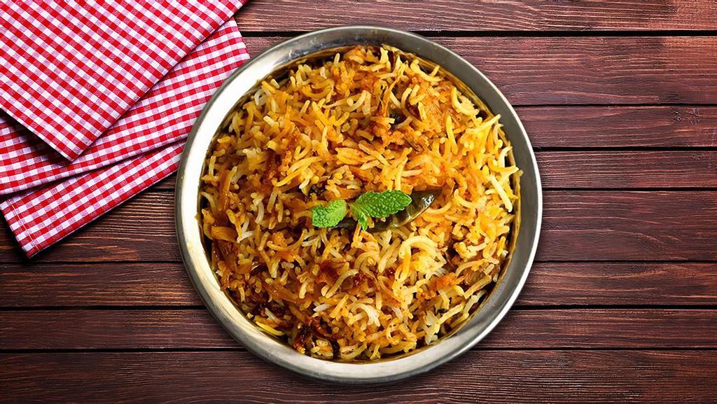 Veggie Biryani · Basmati rice cooked with vegetables and fresh herbs, spices and cooked in a special home-made biryani masala and avakai (mango) paste.