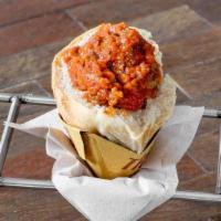 Polpetta Al Sugo (Meatball) · Freshly baked pizza bianca filled with Nonna's beef meatball in a hearty tomato sauce.