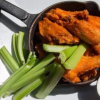 Wings · Mild, regular, hot, sicilian, honey BBQ, chipotle BBQ or Thai, blue cheese, and celery sticks.