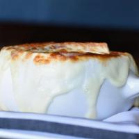 French Onion Soup · Toasted baguette, caramelized mozzarella + swiss.