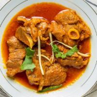 Goat Curry · Fresh goat in curry sauce. Serve with basmati rice, and a can of soda.