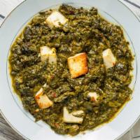 Palak Paneer · Fresh spinach and cheese cubes cooked with herbs and spices. Served with basmati rice.