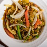 Bhindi Masala · Okra cooked with onion, tomato, herbs and spices. Served with rice, and soda.