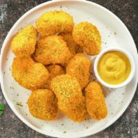 Chicken Nuggets · Bite sized nuggets of chicken breaded and fried until golden brown. Served with your choice ...