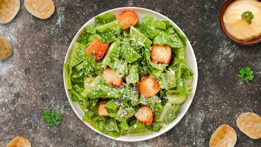 Caesar Chaser Salad · (Vegetarian) Romaine lettuce, house croutons, and parmesan cheese tossed with Caesar dressing.