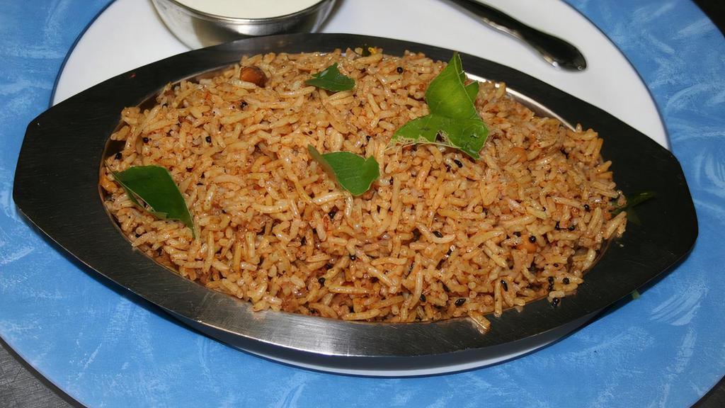 Puliyogare · A very traditional south indian rice speciality with a blend of tamarind and other special spices and herbes served with plain yogurt.