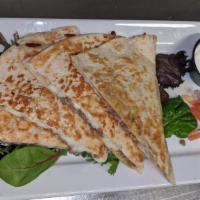 Quesadilla · Choice of chicken, beef, pork or cheese, served with pico de gallo and sour cream.