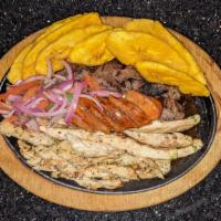 Parrilla Mixta · Platter of assorted grilled meats, churrasco, grilled chicken, shrimp & tostones served with...