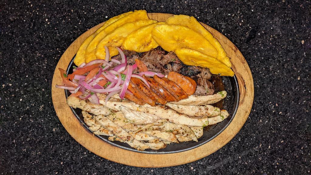 Parrilla Mixta · Platter of assorted grilled meats, churrasco, grilled chicken, shrimp & tostones served with mojito sauce. 
(Sub chorizo for shrimp)