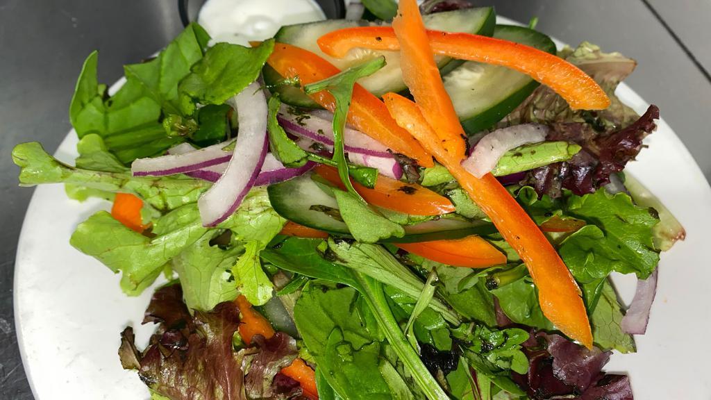 House Salad · Mixed greens, cucumbers, tomatoes, red bell peppers, shredded carrot, red onions, and balsamic vinaigrette.
