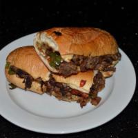 Philly Cheese Steak · Toasted buttered hero stuffed with thinly sliced Steak, provolone cheese, peppers and onions...