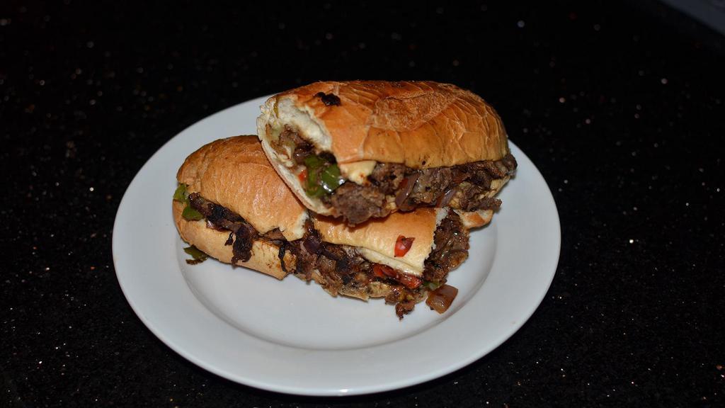 Philly Cheese Steak · Toasted buttered hero stuffed with thinly sliced Steak, provolone cheese, peppers and onions. Choice of skinny or curly fries.