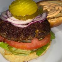Classic Burger · 9oz 100% beef patty, lettuce, tomato, red onions, pickles & mayo/ketchup sauce on a toasted ...
