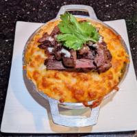 Baked Mac & Cheese · Our homemade four cheese blend baked mac & cheese, served in a mini caldero, served with cho...