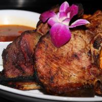 Pork Chops (2) · Choice of fried or grilled, served. with pico de gallo, mojito and two of our delicious sides.
