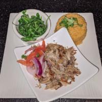Pernil · Slow roasted pork, with a robust garlic and oregano flavor, served with pico de gallo, mojit...