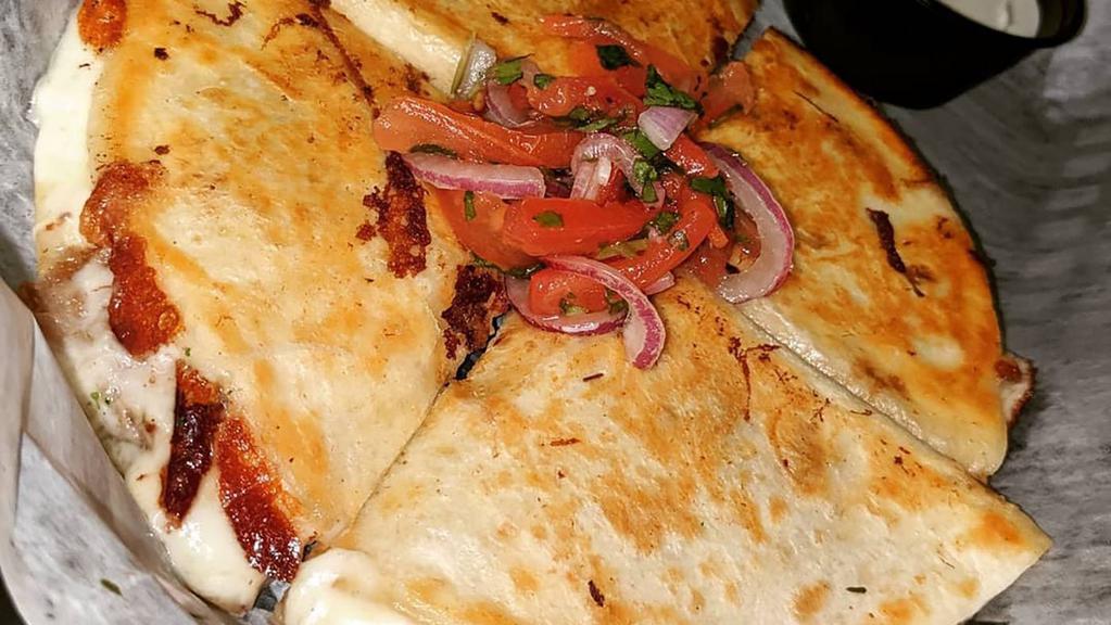 Kids Quesadilla · 6in. Round Quesadilla filled with choice of; Chicken, Beef, Pork or Cheese.
