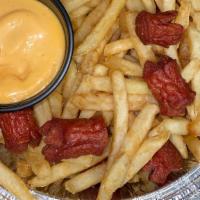 Salchipapas · Thinly sliced pan-fried beef hotdogs and French fries, mixed together with a side of mayo ke...