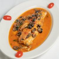 Striped Bass Livornese · Striped bass with olives and capers in a light tomato sauce.
