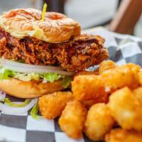 Hot Chicken Sandwich · Spicy. Crispy chicken thigh, secret herbs and spices, buttermilk mayo, lettuce, onion and pi...