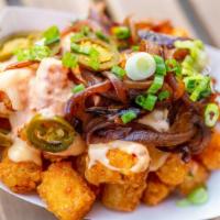 Tots · Vegetarian. Add queso, charred onions and special sauce for an additional charge.
