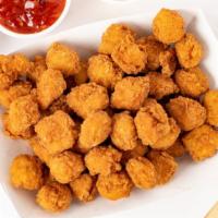 Popcorn Chicken · Popcorn Chicken with choice of Buffalo, BBQ, or Sweet Crunchy on side.