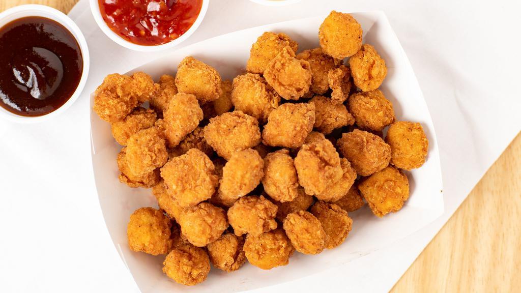 Popcorn Chicken · Popcorn Chicken with choice of Buffalo, BBQ, or Sweet Crunchy on side.
