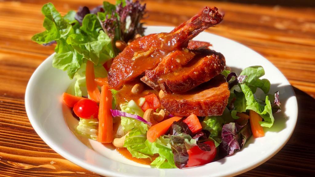 Duck Salad · Crispy boneless duck (quart duck), green apple, red onion, tomatoes, pineapple and cashew nuts mixed with lime dressing.
