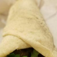 Kafta (Lamb) · Favorite. Ground lamb and beef served with hummus and an onion, parsley and sumac salad, all...