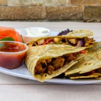 Grilled Chicken Quesadilla · A Southwestern blend of melted Cheddar and Jack cheese, caramelized onions and roasted peppe...