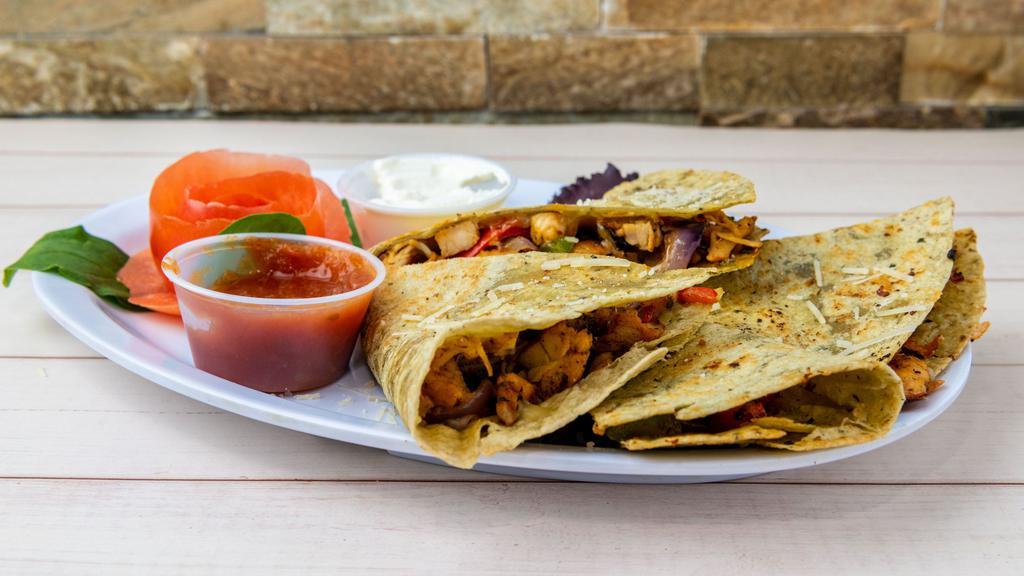 Grilled Chicken Quesadilla · A Southwestern blend of melted Cheddar and Jack cheese, caramelized onions and roasted peppers on a grilled tortilla. Served with sour cream, pico de gallo salsa and your choice of plain or whole wheat wrap.