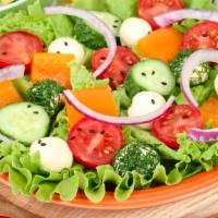 Garden House Salad · Fresh salad made with Romaine lettuce, tomatoes, carrots, cucumbers, and red cabbage.