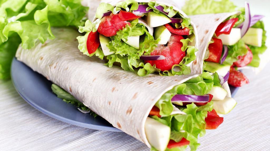 Healthy Wrap · Fresh vegetarian. Grilled and marinated vegetables, goat cheese and spinach with vinaigrette.