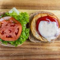 Salmon Burger · Salmon burger, whole wheat burger bun, lettuce, tomato, vegan ketchup,  vegan mayonnaise, ga...