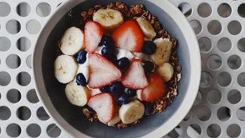 Granola Parfait · Honey toasted granola, Greek yogurt, an assortment of berries (including bananas), shredded ...