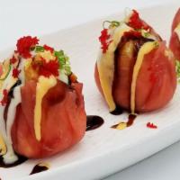 Tuna Or Salmon Dumpling · Thinly sliced tuna or salmon stuffed with spicy crab stick, blue crab meat and seaweed salad...