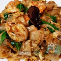 Pad Kea Mow · Stir fried fresh wide rice noodles with eggs, chill, garlic, eggplants, onlons, scallions, m...
