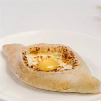 Adjaruli Khachapuri  · Boat shaped oven baked dough stuffed with molten cheese, topped with egg & a choice of a but...
