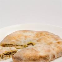 Kubdari · Mountain style meat pie packed with tender chopped pork along with onions, herbs & Georgian ...