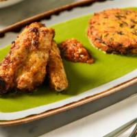Corner Delhi Tandoori Chicken (Gluten-Free) · Cascun Farms fully pastured, boneless thighs, curry sauce verde, Bombay potato croquettes, b...