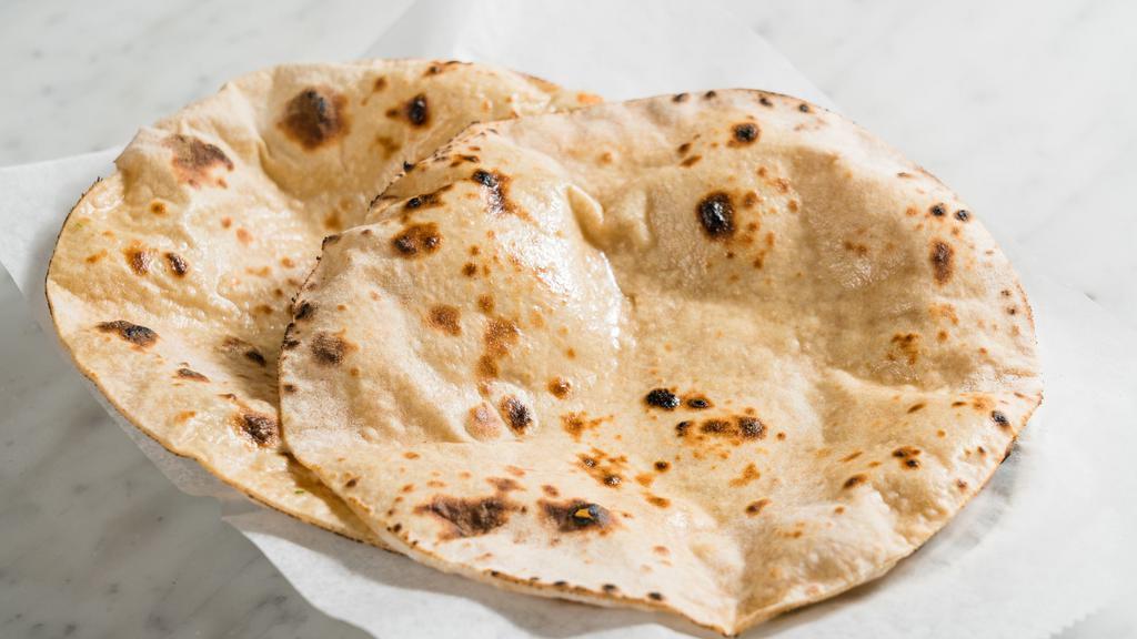 Freshy-Baked Naan (1 Piece) Vegetarian · fresh made to order Indian flatbread, garlic infused ghee