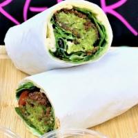 Falafel Wrap · Falafel, it self made out of garbanzo beans, onion, parsley, garlic and spices, in the wrap ...