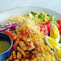 Cobb Salad · Gluten-free. Seasonal mixed green, tomatoes, seared chicken breast, hard boiled eggs, red on...