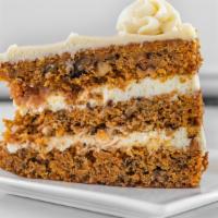 Carrot Cake · Classic layered carrot cake with walnuts, cinnamon spice and cream cheese frosting.