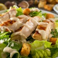 Grilled Chicken Caesar Salad · Romaine Lettuce, Roasted Peppers, Grilled Chicken Strips, Croutons & Caesar Dressing.