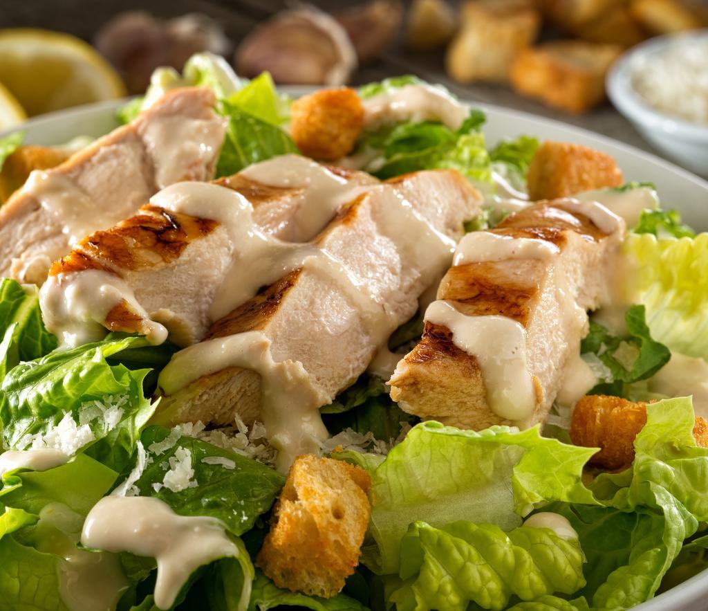 Grilled Chicken Caesar Salad · Romaine Lettuce, Roasted Peppers, Grilled Chicken Strips, Croutons & Caesar Dressing.