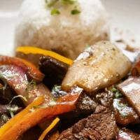 Lomo Saltado · Beef or chicken sauteed with tomatoes, onions, cilantro with fries and rice.